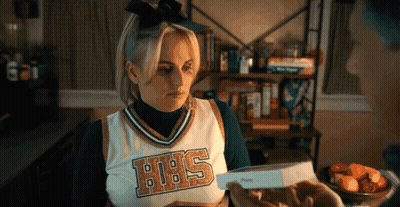 A Cheerleader Wearing A Uniform That Says Hhs On It GIF