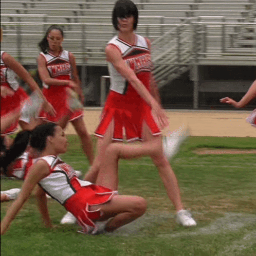 A Cheerleader Wearing A Uniform That Says Wmhs On It GIF