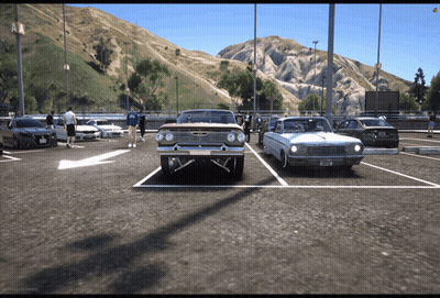 A Chevrolet Impala Is Parked Next To A Mustang GIF