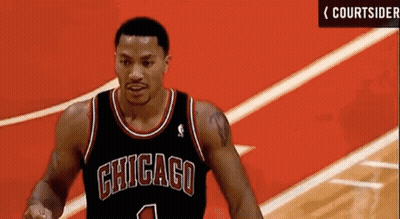 A Chicago Bulls Basketball Player Wearing A Black Jersey With The Number 1 On It GIF