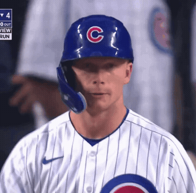 A Chicago Cubs Baseball Player Wearing A Blue Helmet With The Letter C On It GIF