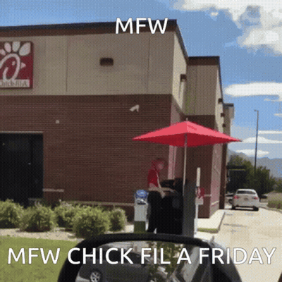 a chick-fil-a drive-thru with a red umbrella in front of it