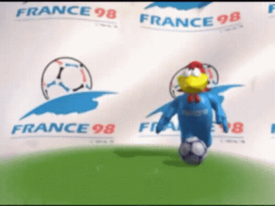 A Chicken Mascot Is Kicking A Soccer Ball In Front Of A Banner That Says France 98 GIF