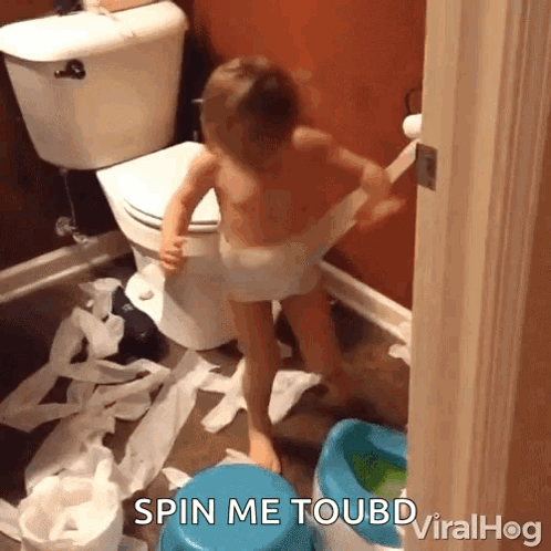 A Child In A Diaper Is Playing With Toilet Paper In A Bathroom With The Caption Spin Me Toubd Viralhog GIF