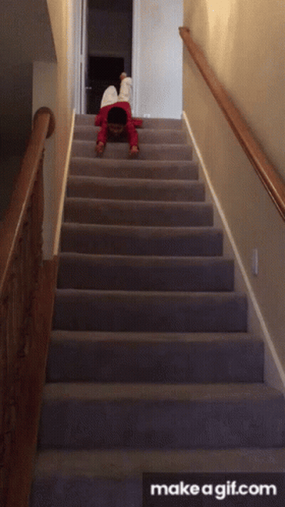 A Child Is Crawling Up A Set Of Stairs With Make A Gif.com In The Bottom Right Corner GIF