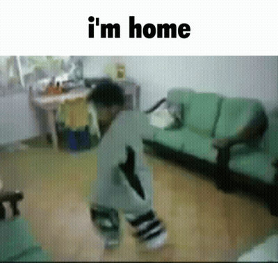 A Child Is Dancing In A Living Room With The Words " I 'M Home " Below Him GIF