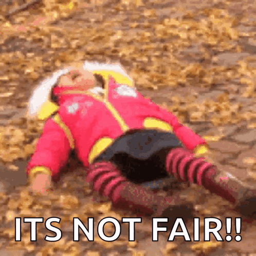 A Child Is Laying On The Ground With The Words It 'S Not Fair GIF