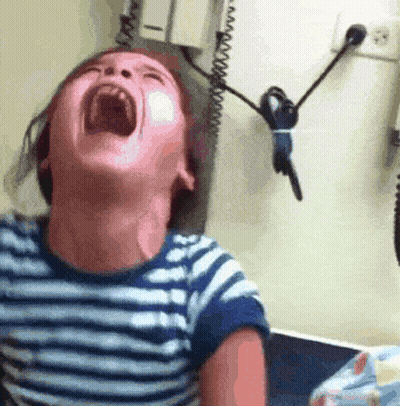A Child Is Screaming With His Mouth Wide Open GIF