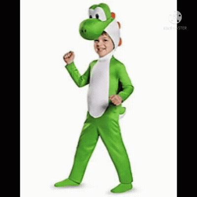 A Child Is Wearing A Yoshi Costume And Standing In Front Of A White Background . GIF