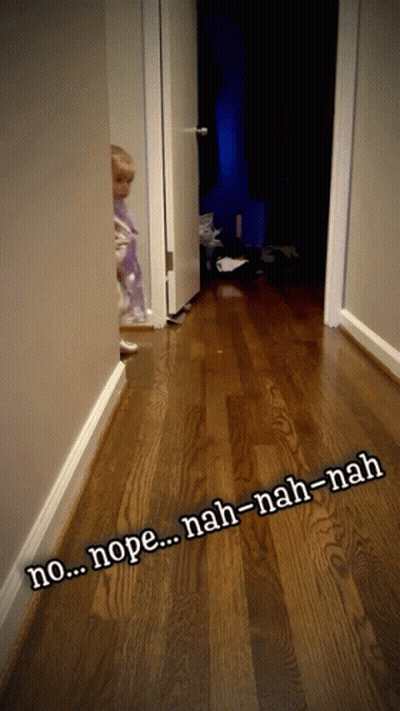 A Child Standing In A Hallway With The Words Nope Nah-Nah-Nah Written On The Floor GIF