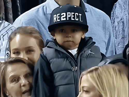 A Child Wearing A Hat That Says Respect On It GIF
