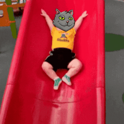 A Child Wearing A Yellow Shirt That Says Steelers Is Going Down A Slide GIF