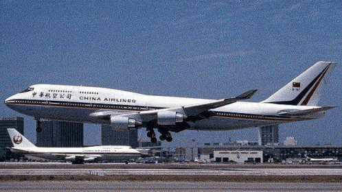 A China Airlines Airplane Is Taking Off From An Airport Runway GIF