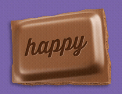 A Chocolate Bar That Has The Word Happy Written On It GIF