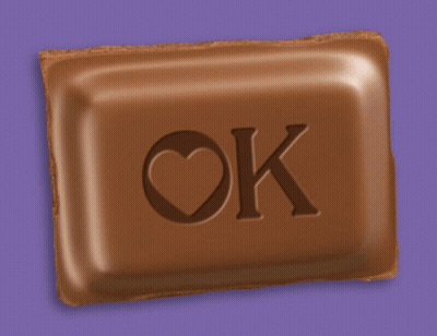 A Chocolate Bar With The Letters Ok And A Heart On It GIF