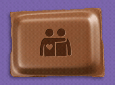 A Chocolate Bar With Two People Hugging Each Other And A Heart On It GIF