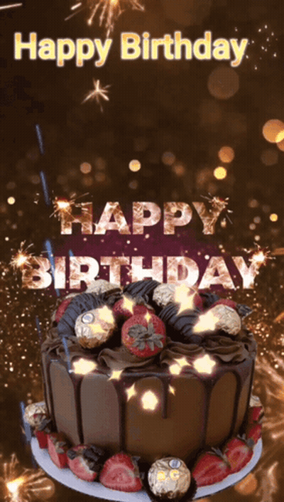 A Chocolate Birthday Cake With Strawberries And Fireworks With The Words Happy Birthday GIF