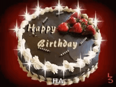 A Chocolate Birthday Cake With Strawberries On Top Of It . GIF