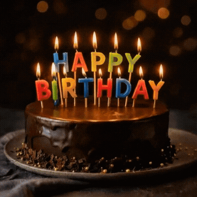 A Chocolate Cake With Candles That Say Happy Birthday GIF