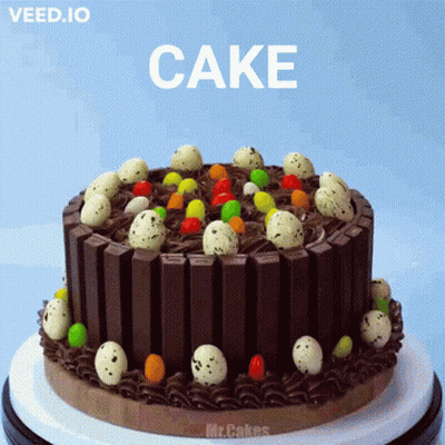A Chocolate Cake With Easter Eggs On Top And The Word Cake On The Bottom GIF