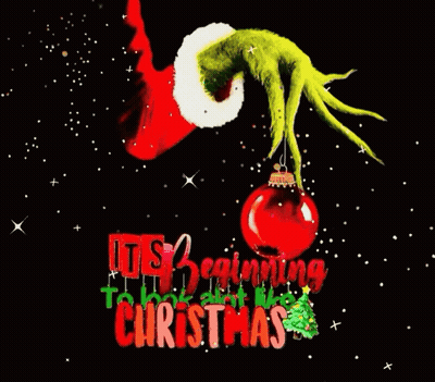 A Christmas Card With A Grinch Holding A Christmas Ornament . GIF