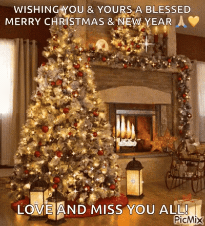 A Christmas Tree In Front Of A Fireplace With The Words Wishing You & Yours A Blessed Merry Christmas And New Year GIF