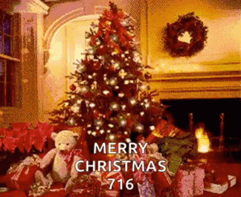 A Christmas Tree Is Sitting In Front Of A Fireplace Surrounded By Presents . GIF