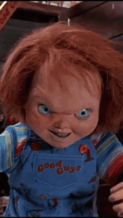 A Chucky Doll From The Movie Good Guys Is Smiling For The Camera GIF