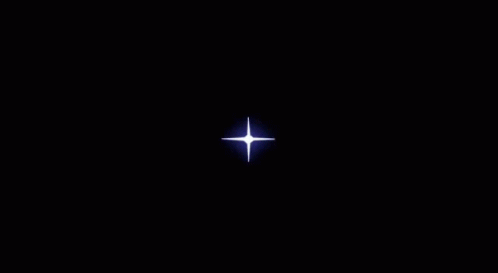 A Circle Of Fire With A Light Coming Out Of It On A Dark Background . GIF