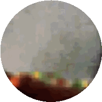 A Circle With A Blurred Image Of A City Sticker