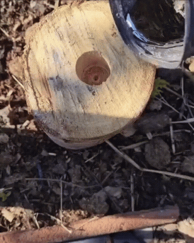 A Circular Piece Of Wood With A Hole In The Middle GIF