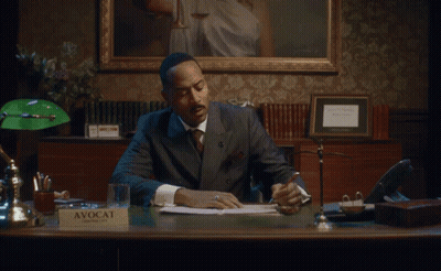 A Cisco Phone Is Sitting On A Desk Next To A Calendar GIF