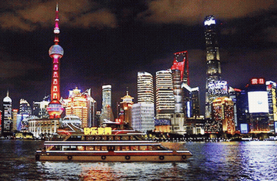 A City Skyline At Night With A Boat In The Foreground That Says ' Happy New Year ' On It GIF