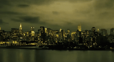A City Skyline With The Empire State Building In The Distance GIF