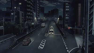 A City Street At Night With Cars Driving Down It And A Sign That Says ' Tokyo ' On It GIF