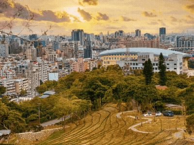 A Cityscape With A Stadium In The Foreground And A Park In The Foreground GIF