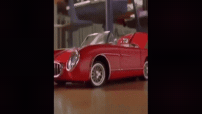 A Classroom With A Lot Of Desks And Chairs And A Person Standing In The Middle Of The Room . GIF