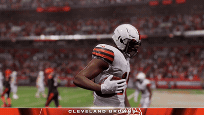 A Cleveland Browns Player Is Running With The Ball GIF