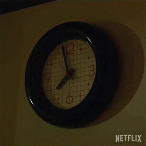 A Clock On A Wall With A Netflix Logo In The Corner GIF