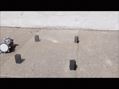 A Clock Sits On A Concrete Surface Next To A Few Bricks GIF