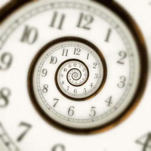 A Clock That Has The Hands On The Numbers 10 And 12 GIF