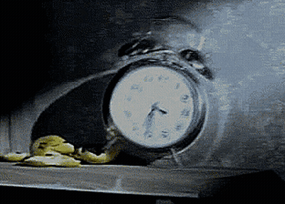 A Clock With A Face On It Shows That It Is Almost 5:00 GIF