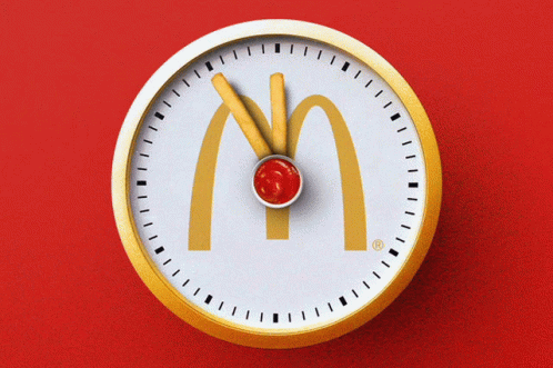 A Clock With The Mcdonald 'S Logo And Ketchup On It GIF