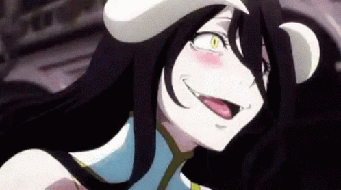 A Close Up Of A Anime Character With Her Tongue Out And A Hat On Her Head . GIF