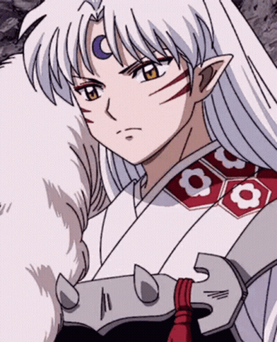 A Close Up Of A Anime Character With Long White Hair And A Sword . GIF