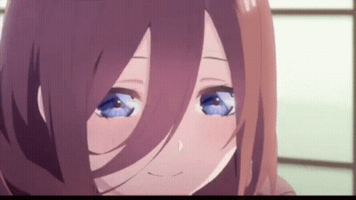 A Close Up Of A Anime Girl With Blue Eyes And Brown Hair . GIF
