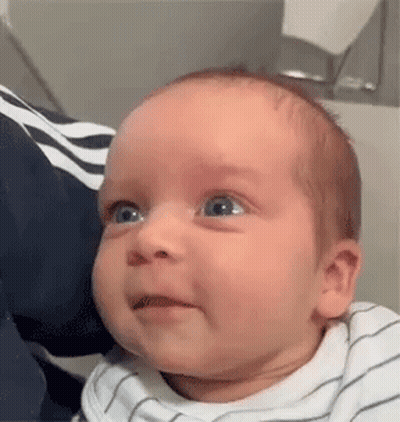 A Close Up Of A Baby Making A Funny Face . GIF