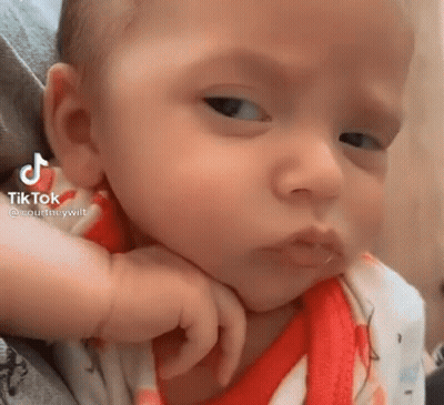 A Close Up Of A Baby Making A Funny Face . GIF