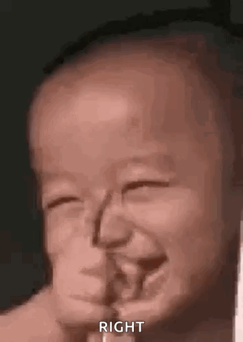 A Close Up Of A Baby Making A Funny Face With His Eyes Closed . GIF