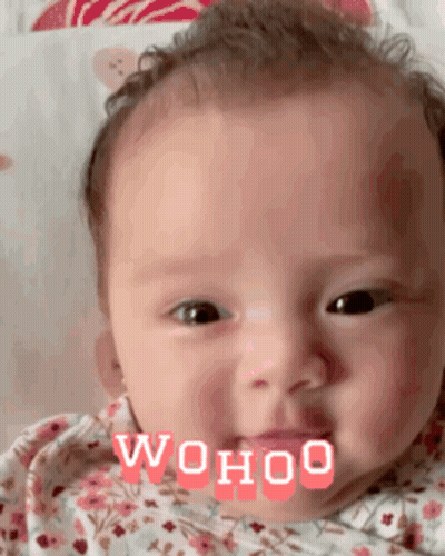 A Close Up Of A Baby 'S Face With The Words ' Wohoo ' Written On It . GIF